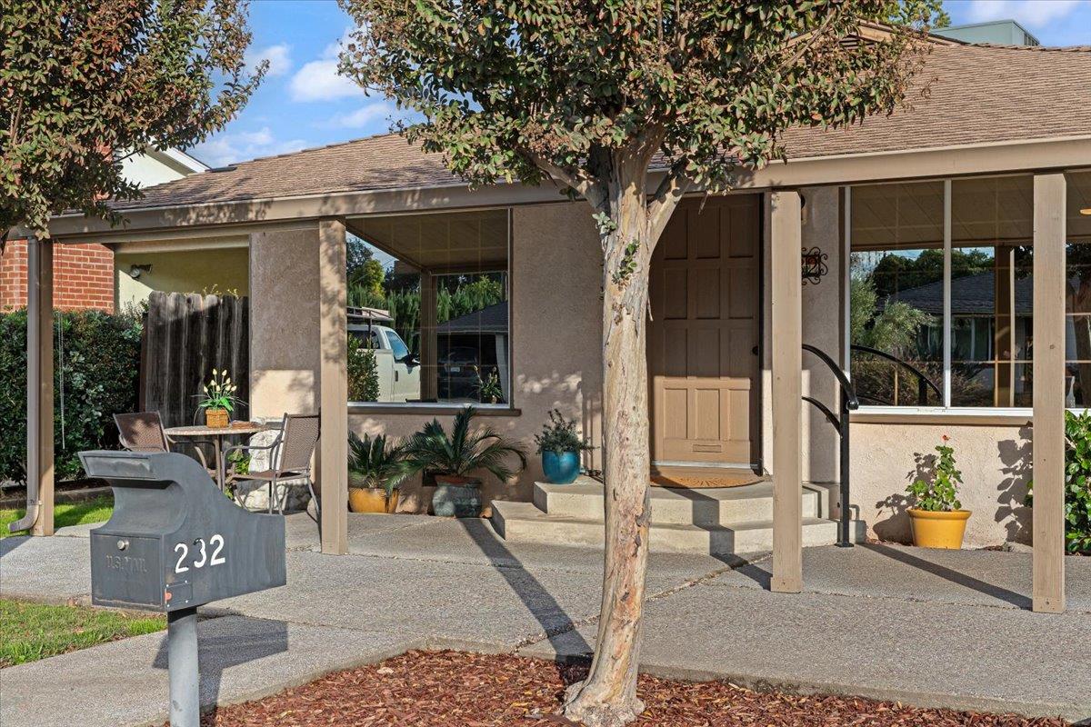 232 Fusco Avenue Modesto, CA 95354 - Photo 5 of 52 a front view of a house with outdoor seating