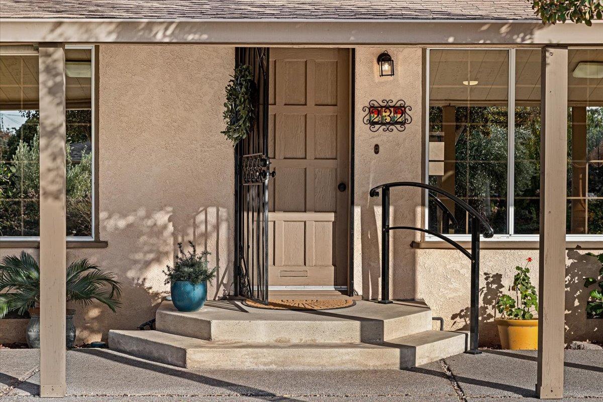 232 Fusco Avenue Modesto, CA 95354 - Photo 6 of 52 a front view of a house with a potted plant
