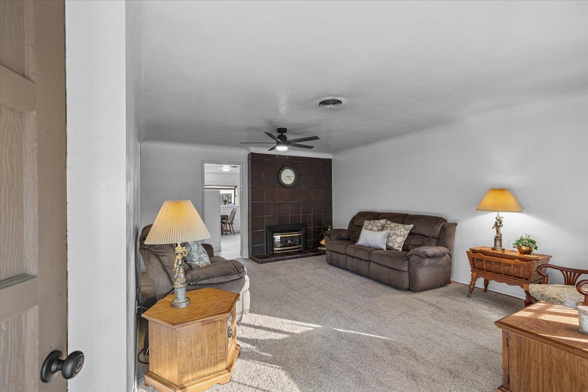 232 Fusco Avenue Modesto, CA 95354 - Photo 7 of 52 a living room with furniture and a chandelier
