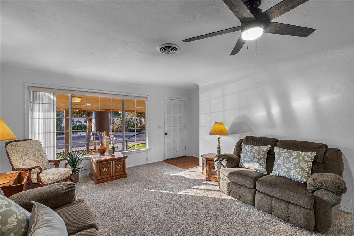 232 Fusco Avenue Modesto, CA 95354 - Photo 9 of 52 a living room with furniture and a lamp