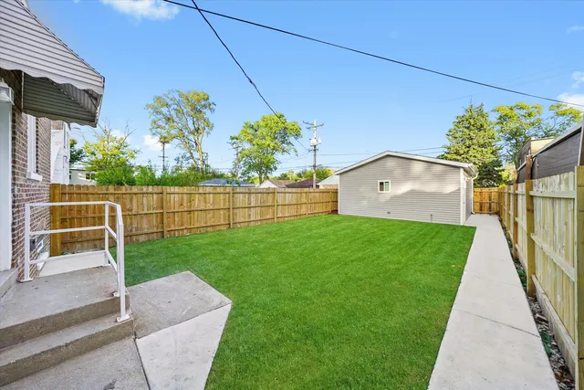 a view of backyard with green space