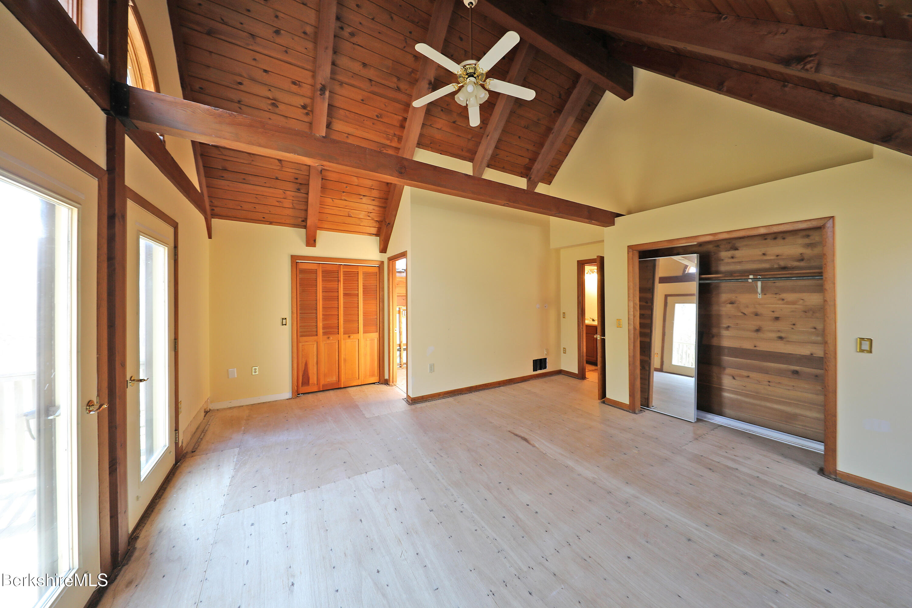 519 Kirchner Road Dalton, MA 01226 - Photo 34 of 42 an empty room with wooden floor and windows