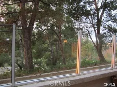 a bathroom with a granite countertop sink a mirror and a bathtub