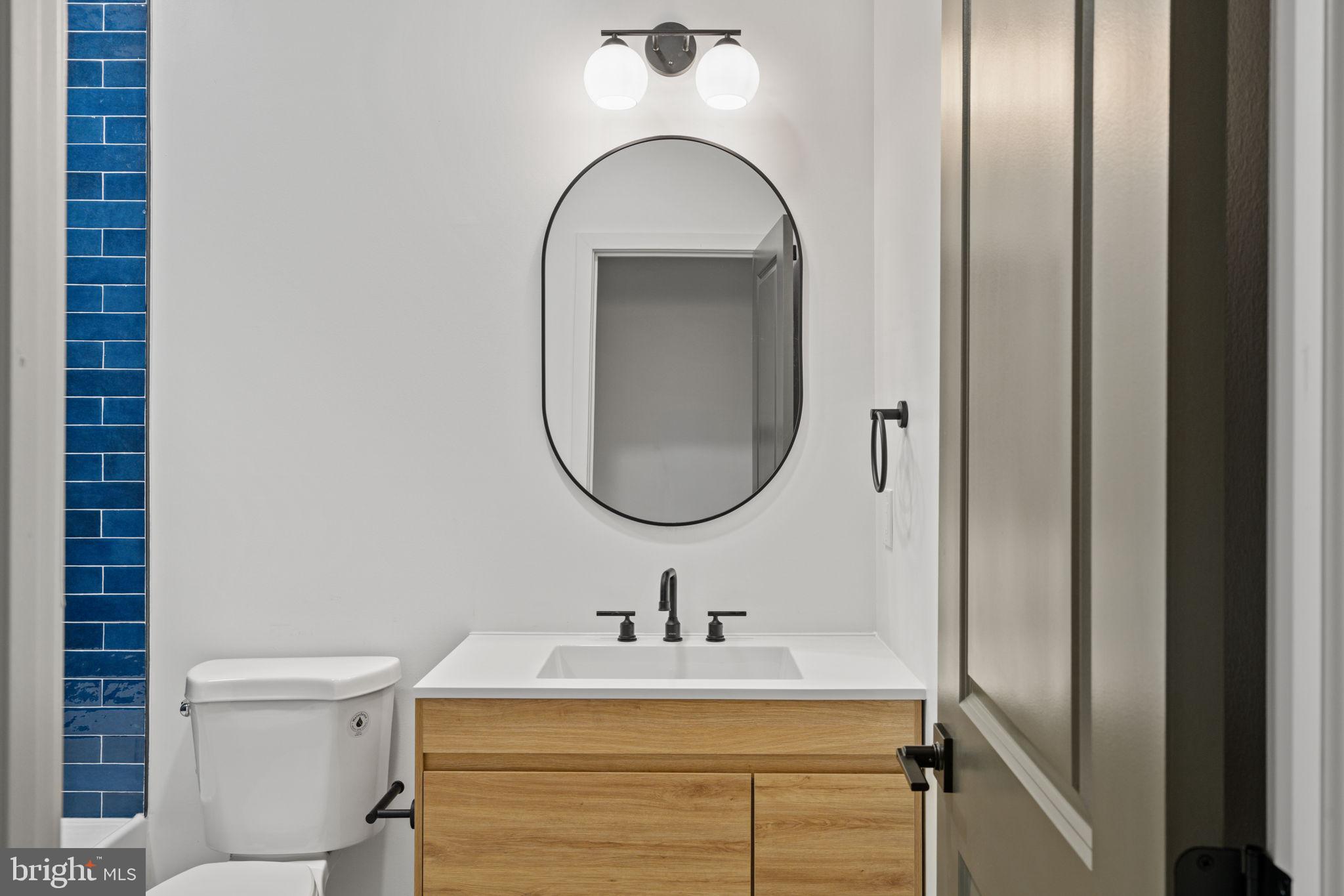 2410 Nicholas Street Philadelphia, PA 19121 - Photo 16 of 55 a bathroom with a sink and a mirror