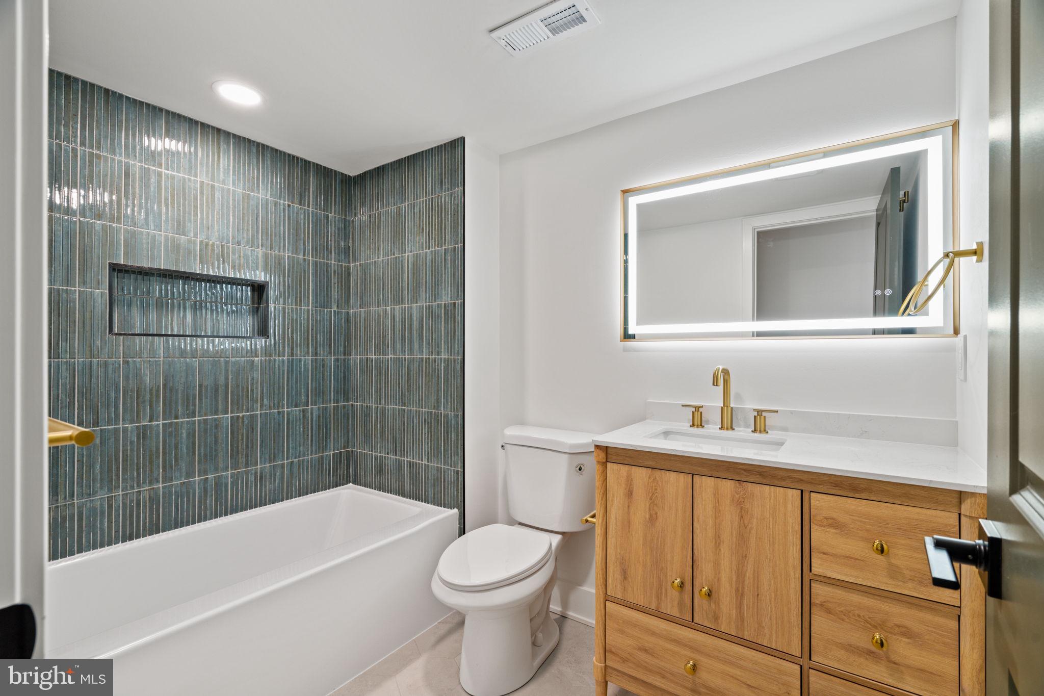 2410 Nicholas Street Philadelphia, PA 19121 - Photo 18 of 55 a bathroom with a sink a toilet and shower