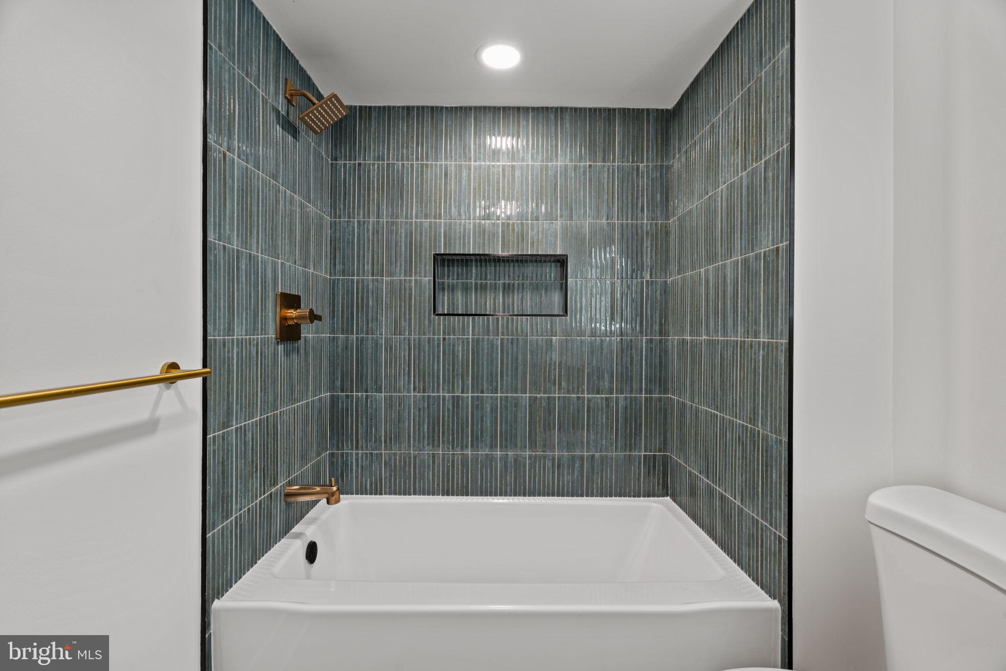 2410 Nicholas Street Philadelphia, PA 19121 - Photo 20 of 55 a bathroom with a bathtub and a shower