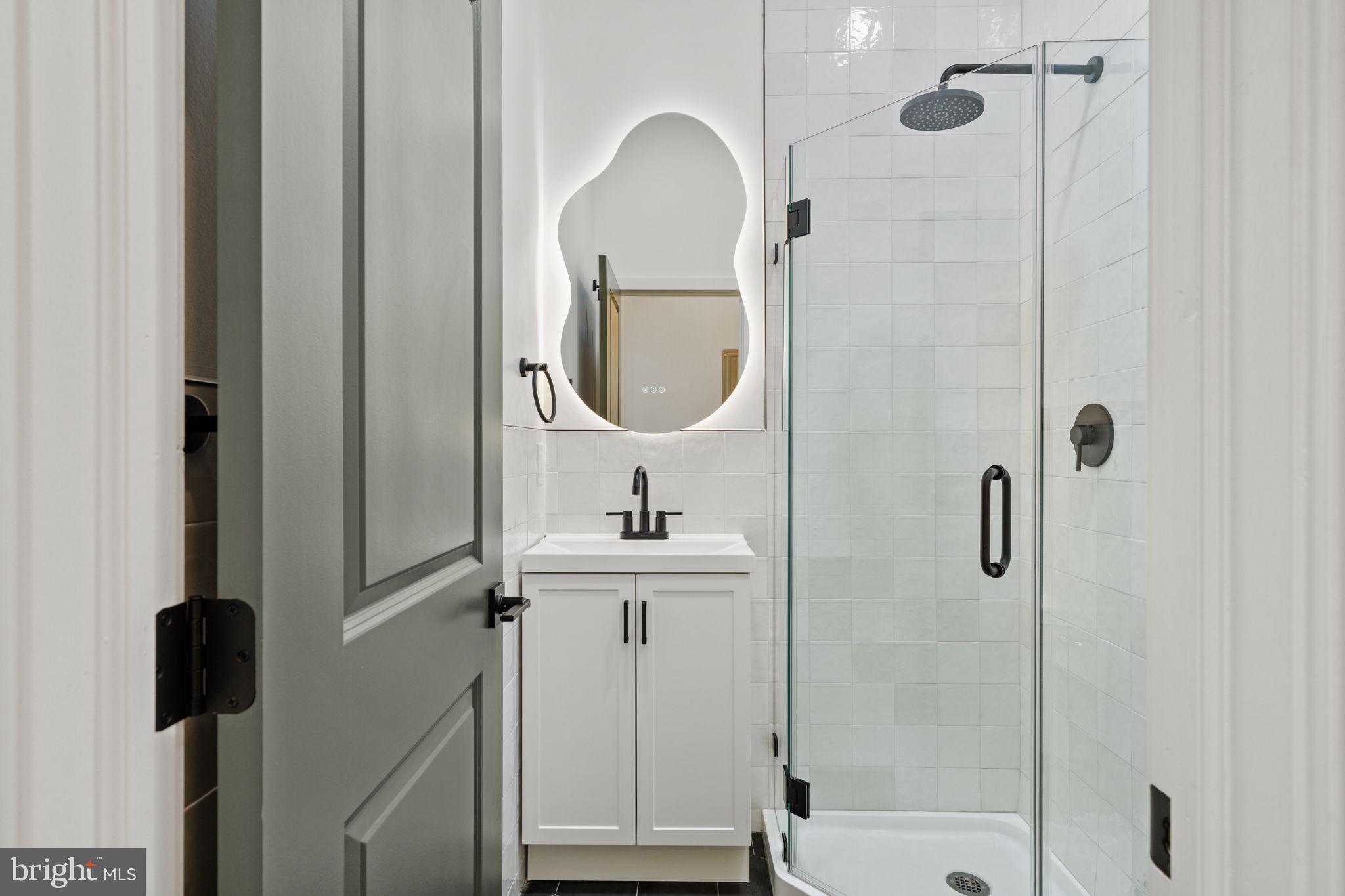 2410 Nicholas Street Philadelphia, PA 19121 - Photo 41 of 55 a bathroom with a sink a toilet and shower