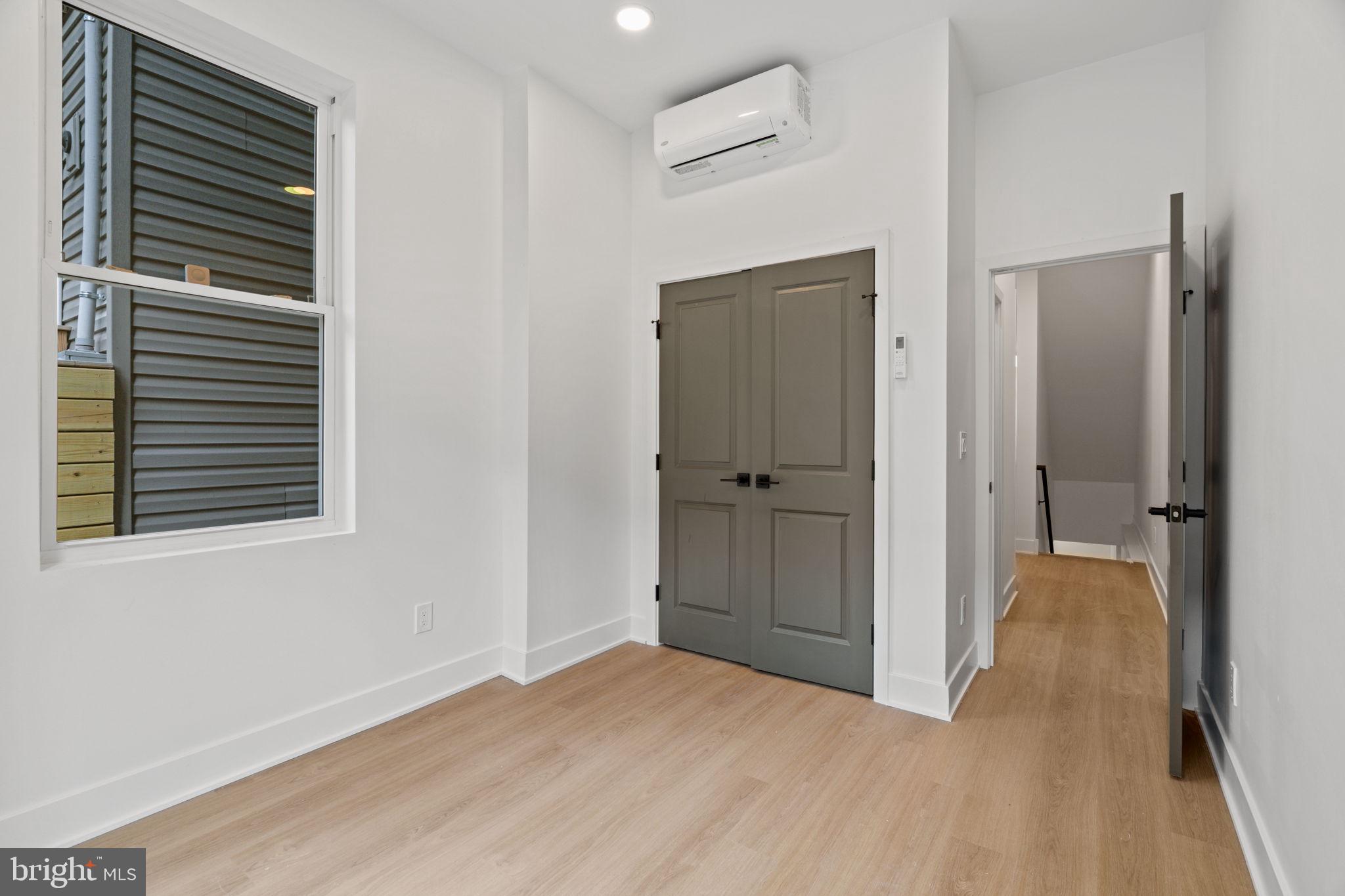 2410 Nicholas Street Philadelphia, PA 19121 - Photo 43 of 55 a view of an empty room with closet and a window