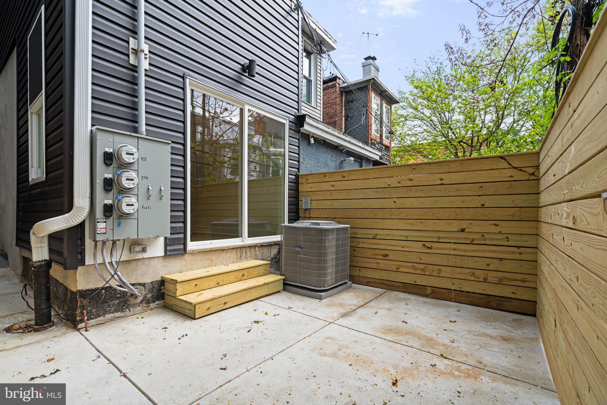 2410 Nicholas Street Philadelphia, PA 19121 - Photo 47 of 55 a view of a patio with table and chairs in the patio