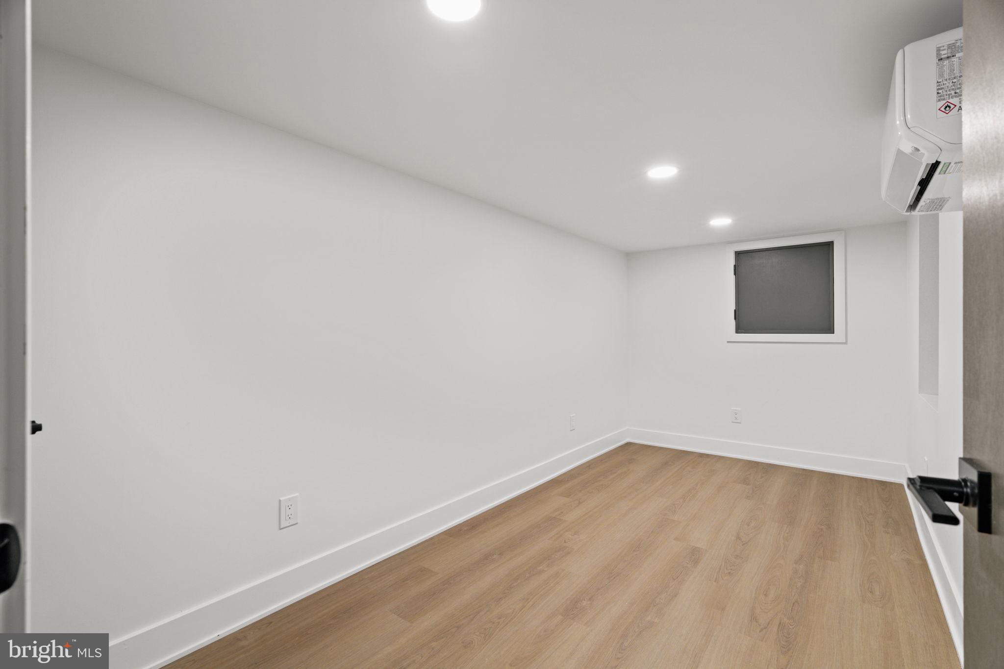 2410 Nicholas Street Philadelphia, PA 19121 - Photo 54 of 55 a view of a room with wooden floor and window