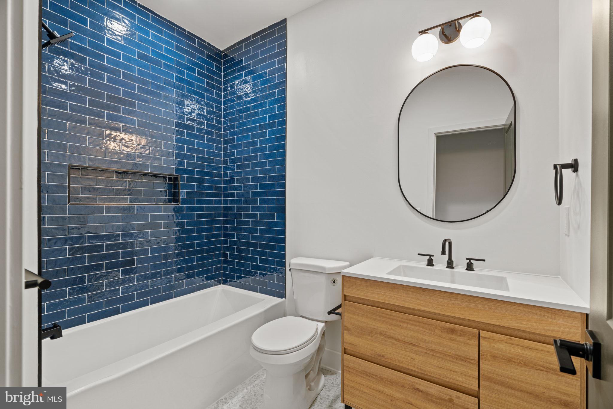 2410 Nicholas Street Philadelphia, PA 19121 - Photo 9 of 55 a bathroom with a sink and a mirror