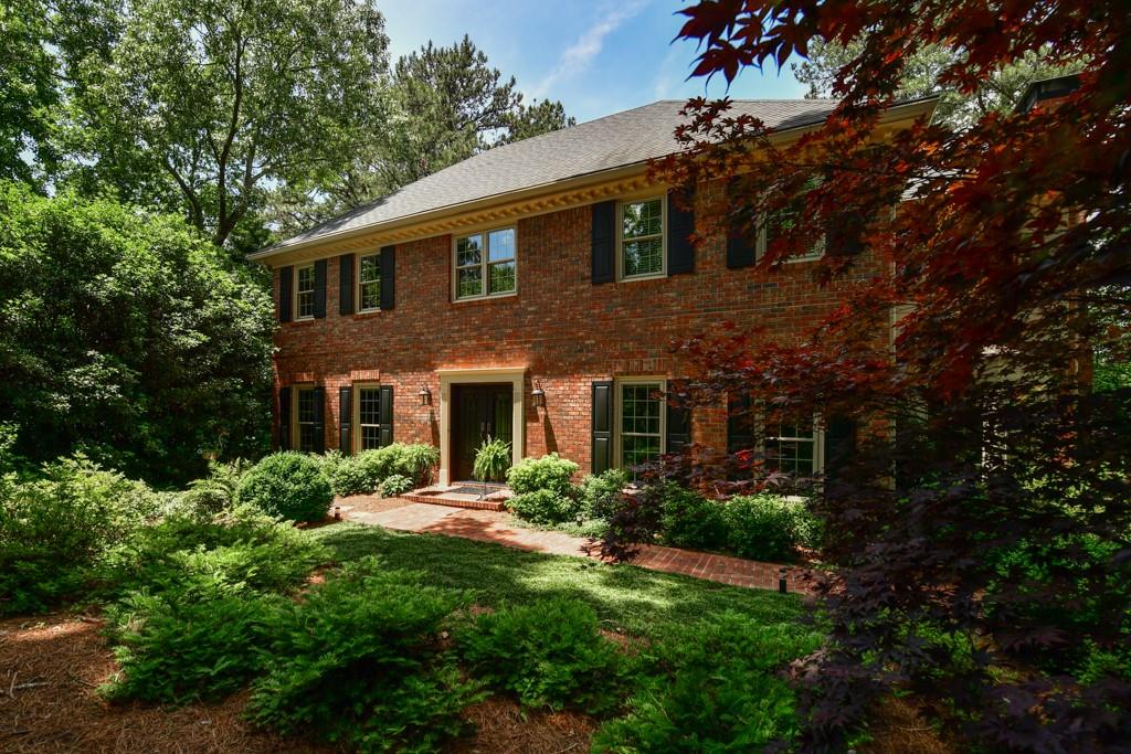 275 Cameron Ridge Drive Northwest Atlanta, GA 30328 - Photo 1 of 1 a front view of a house with a yard