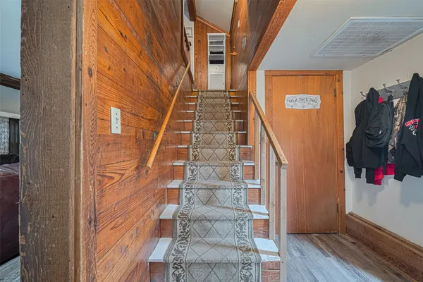 a view of entryway with wooden floor