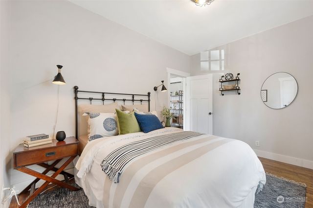 a bedroom with a bed and a chandelier