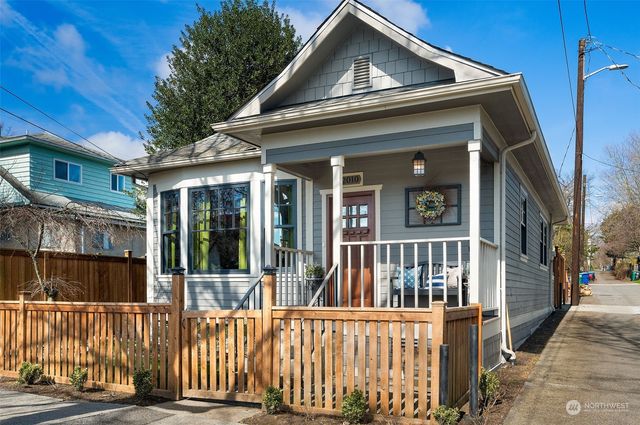 a view of a brick house with large windows