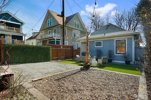 a front view of a house with garden