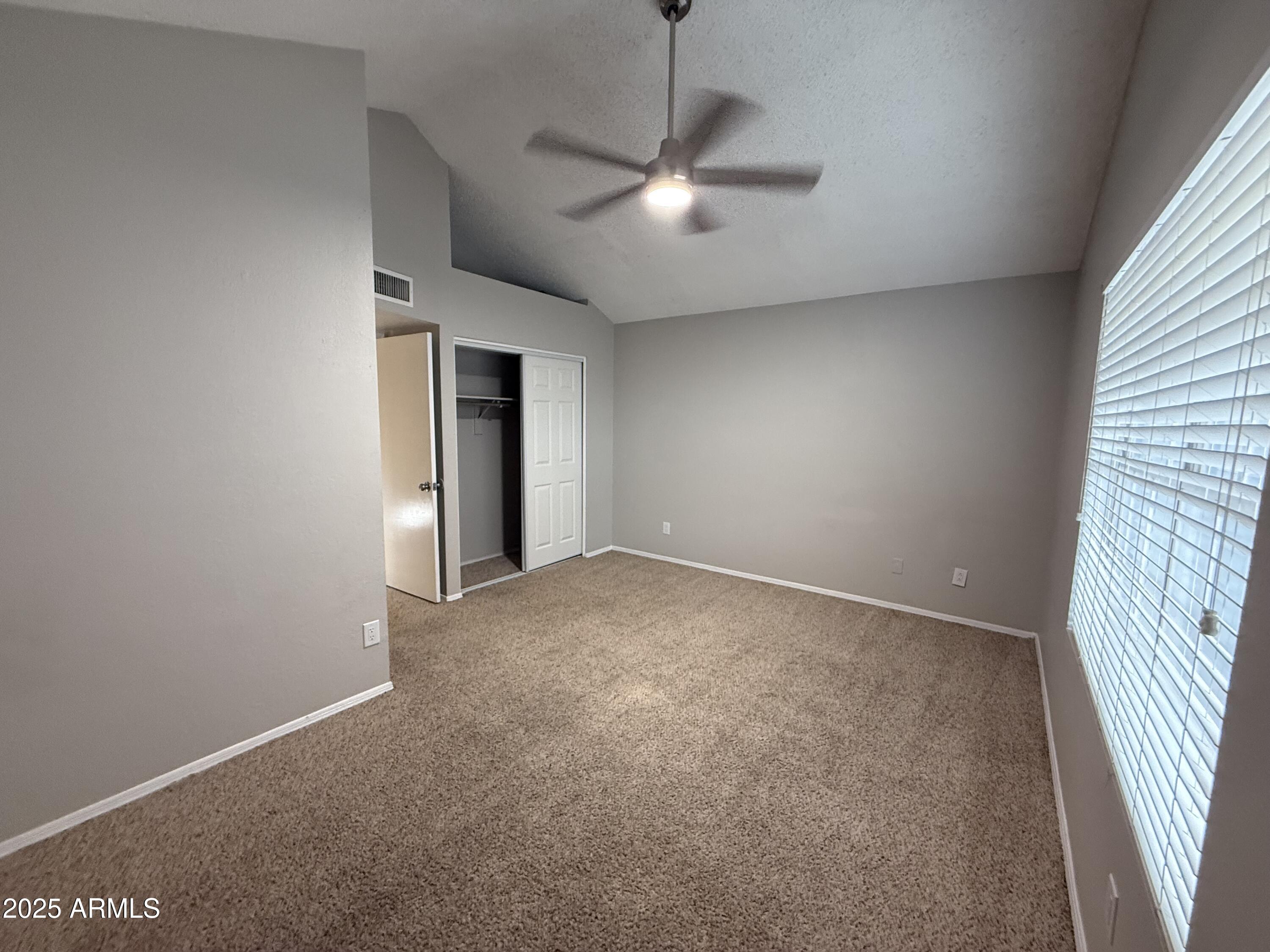 7977 West Wacker Road, Unit 249 Peoria, AZ 85381 - Photo 14 of 17 a view of an empty room with a window