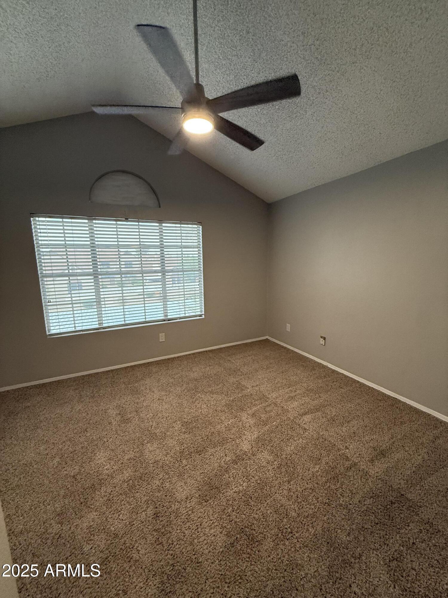 7977 West Wacker Road, Unit 249 Peoria, AZ 85381 - Photo 5 of 17 an empty room with windows
