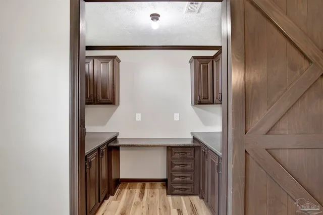 a view of a hallway with entryway