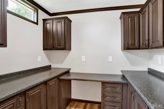 a kitchen with a sink and cabinets