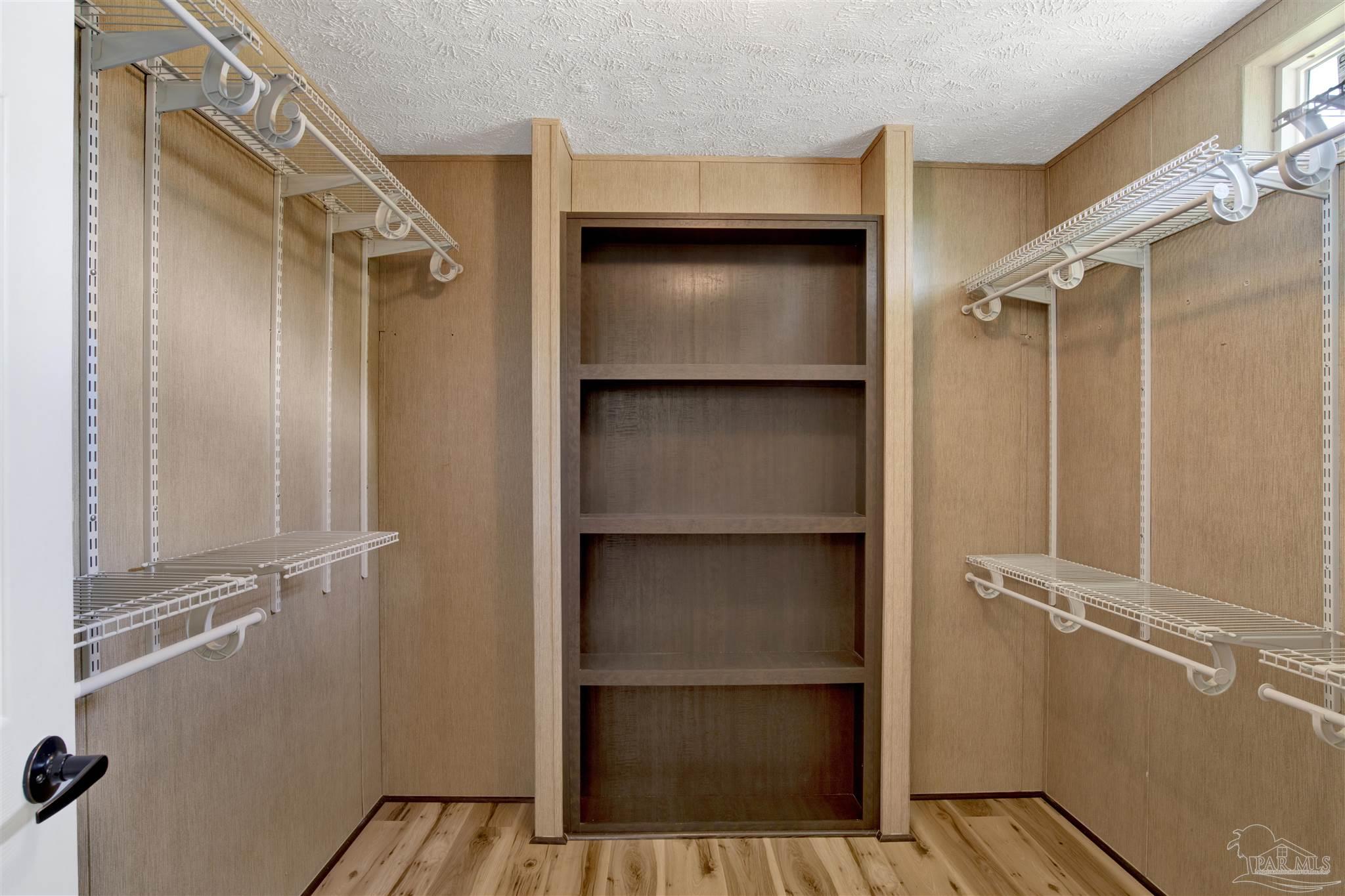 6594 Will Jones Road Jay, FL 32565 - Photo 22 of 39 a view of walk in closet