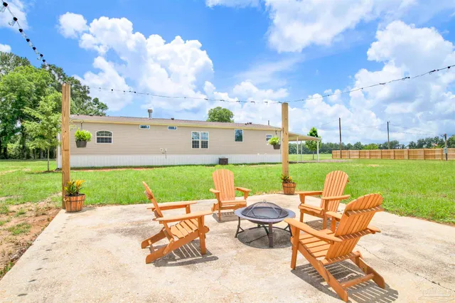 a view of swimming pool and outdoor seating