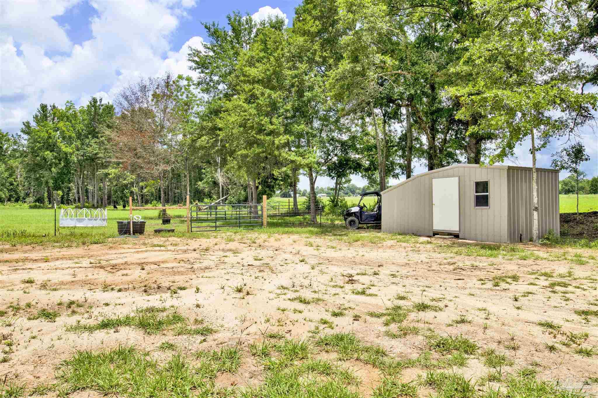 6594 Will Jones Road Jay, FL 32565 - Photo 30 of 39 a house with trees in front of it