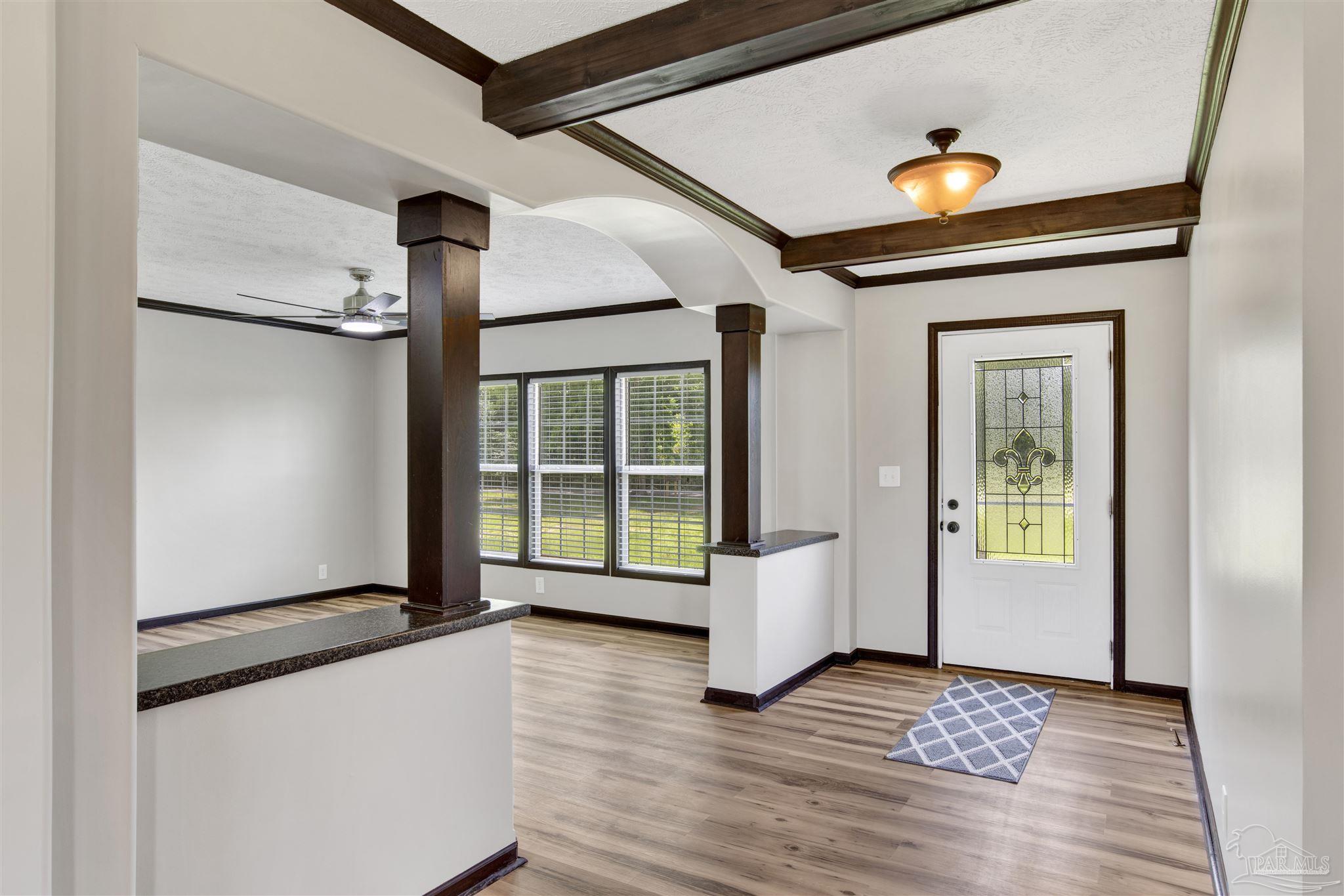 6594 Will Jones Road Jay, FL 32565 - Photo 3 of 39 a view of an entryway with wooden floor