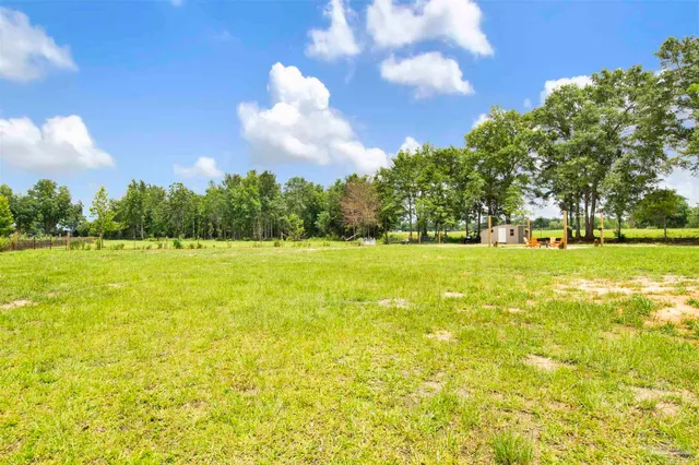 a view of a swimming pool with an outdoor space and seating area