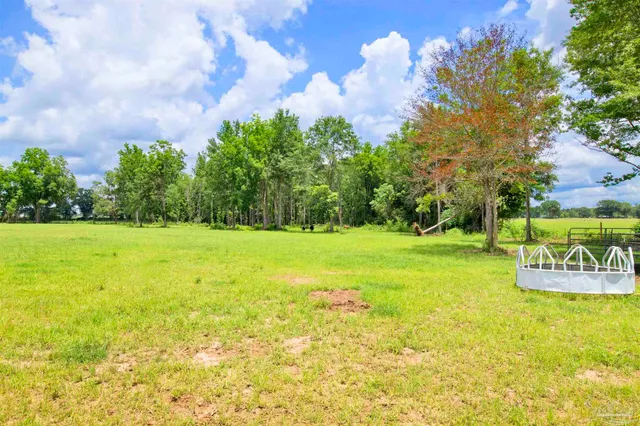 a view of a swimming pool with an outdoor space and seating area