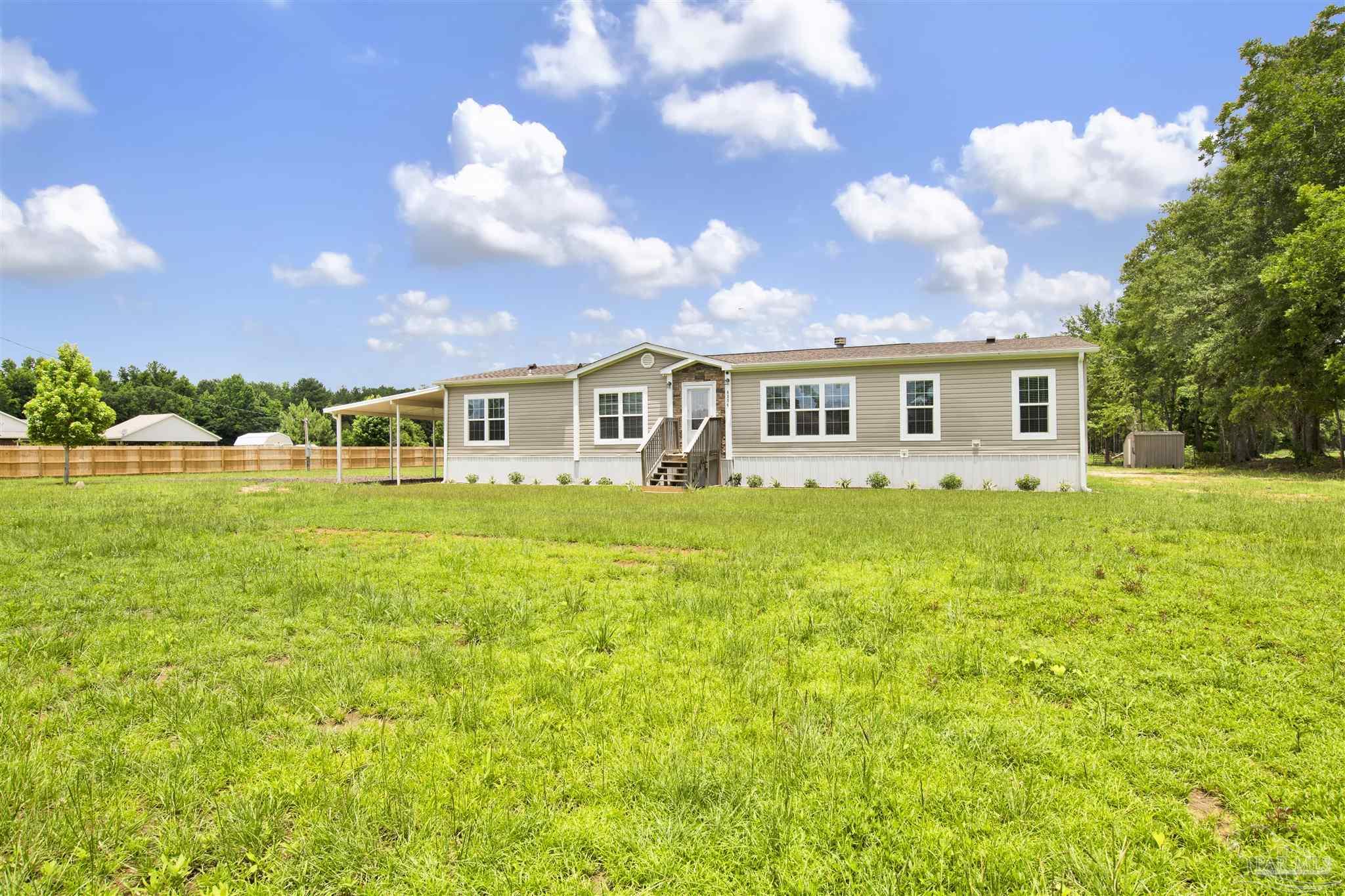 6594 Will Jones Road Jay, FL 32565 - Photo 39 of 39 a view of a house with a big yard