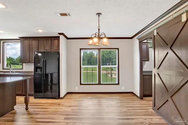 a view of a kitchen with a sink and a window