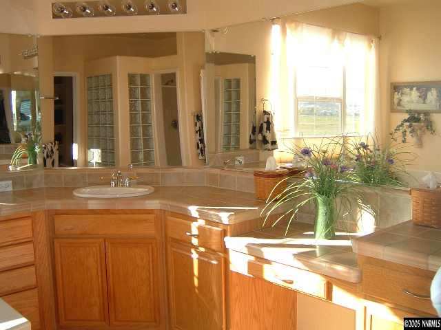 1500 Diamond Country Drive Reno, NV 89521 - Photo 7 of 9 a bathroom with a tub a sink and a large window