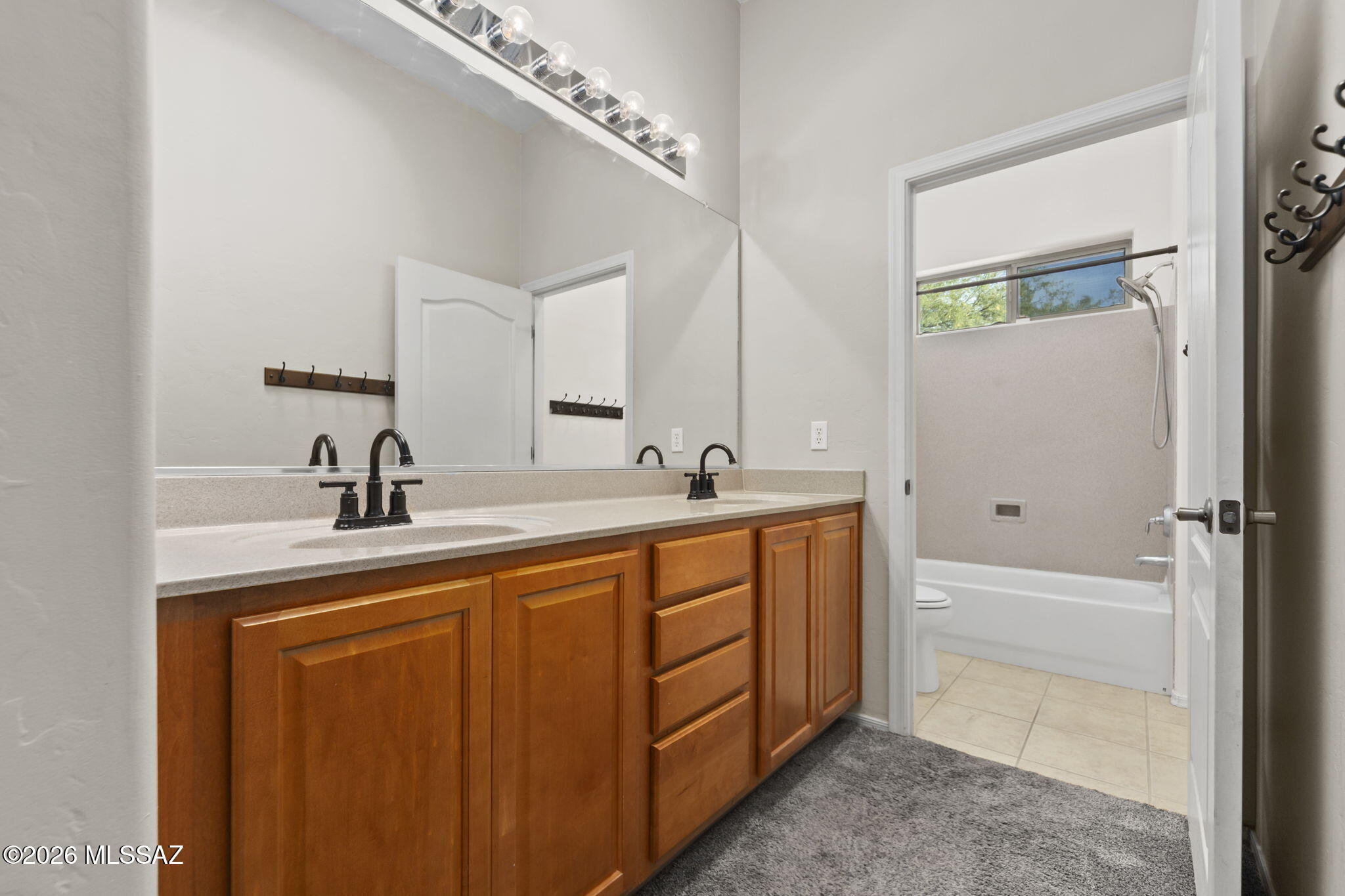 13668 East High Plains Ranch Street Vail, AZ 85641 - Photo 29 of 51 a spacious bathroom with a double vanity sink a mirror and a bathtub
