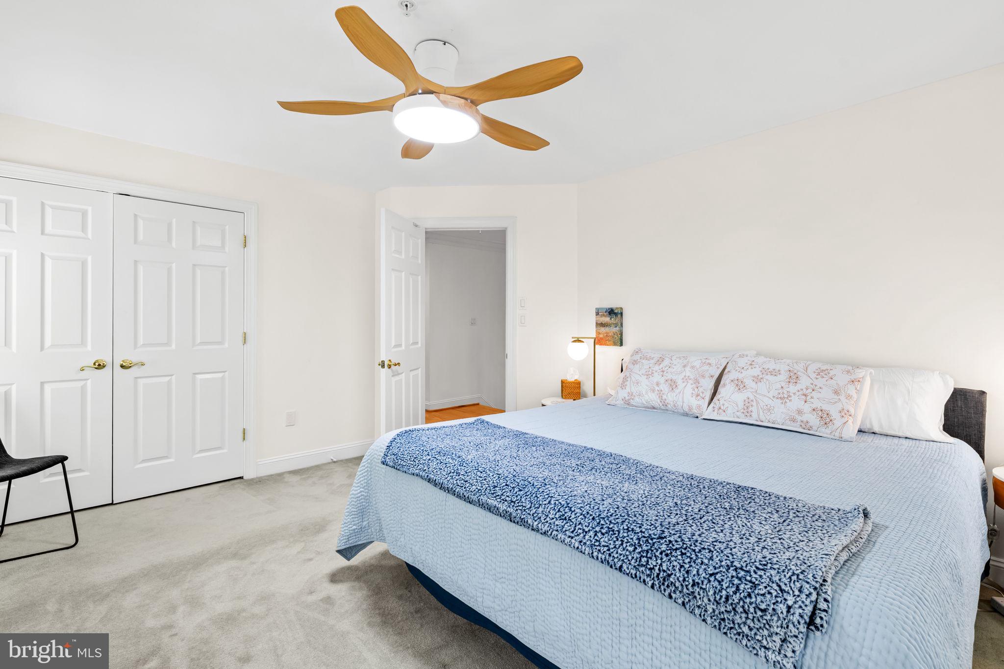 2331 Boston Street, Unit 1 Baltimore, MD 21224 - Photo 43 of 74 a bedroom with a large bed and a chandelier