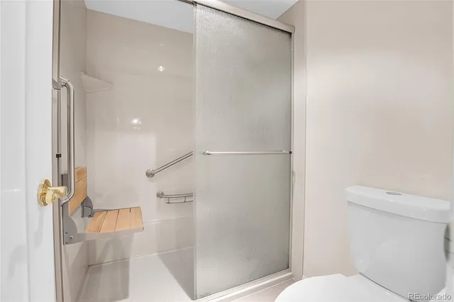 a bathroom with a glass shower door