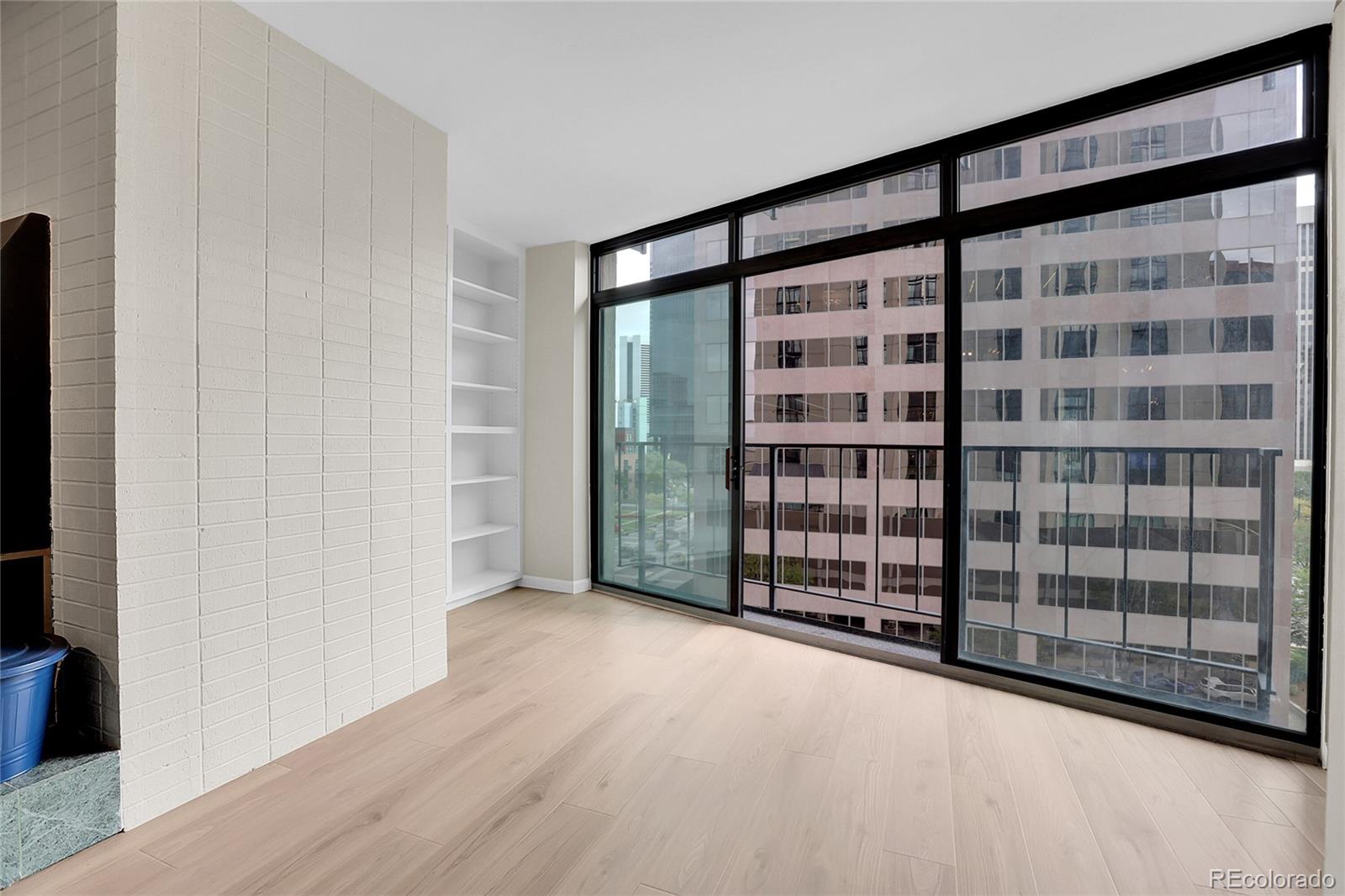 1777 Larimer Street, Unit 807 Denver, CO 80202 - Photo 10 of 25 a view of an empty room with wooden floor and a window