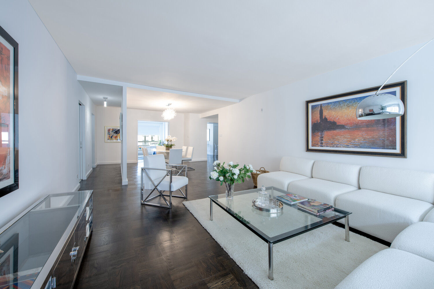 799 Park Avenue, Unit 9A Manhattan, NY 10021 - Photo 1 of 14 a living room with furniture and a table