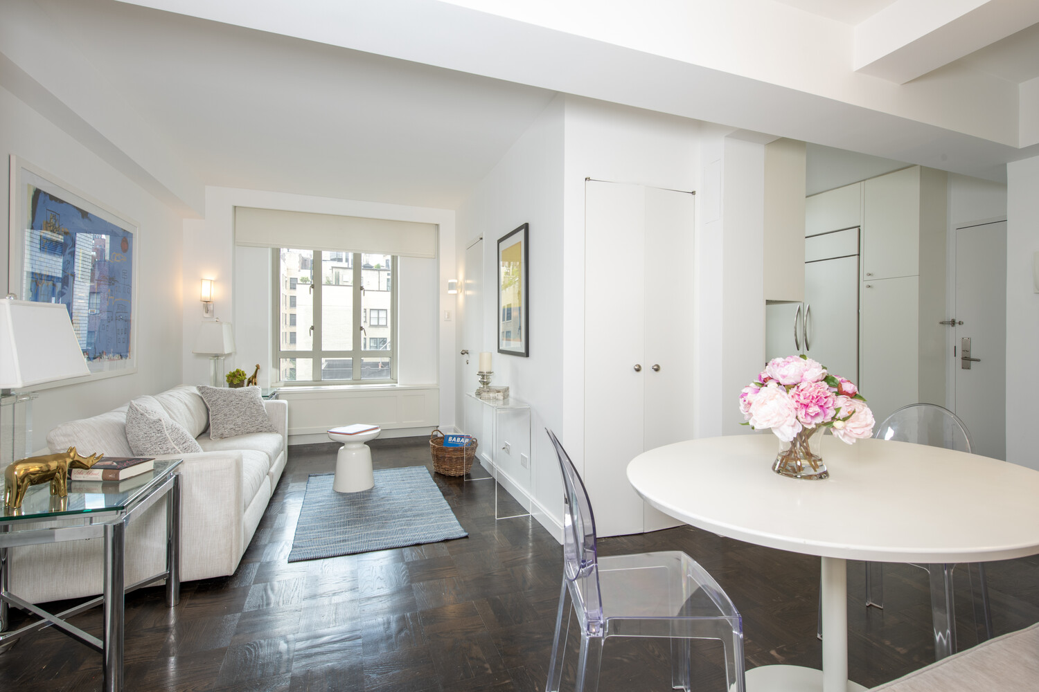 799 Park Avenue, Unit 9A Manhattan, NY 10021 - Photo 4 of 14 a living room with furniture and wooden floor
