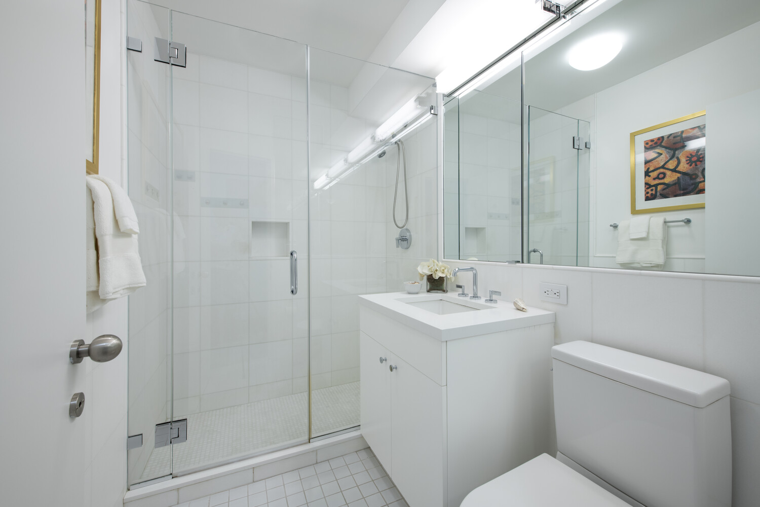 799 Park Avenue, Unit 9A Manhattan, NY 10021 - Photo 9 of 14 a bathroom with a toilet sink and shower