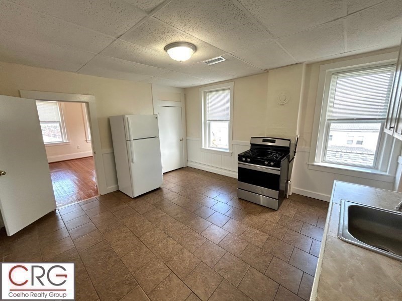 31 Elmwood Street, Unit 6 Revere, MA 02151 - Photo 12 of 16 a living room with furniture and a window