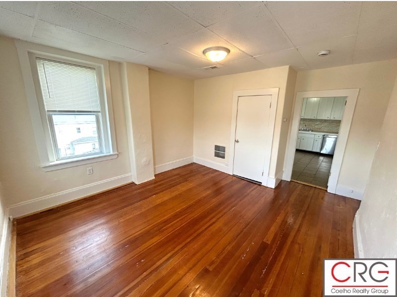 31 Elmwood Street, Unit 6 Revere, MA 02151 - Photo 2 of 16 a view of empty room with wooden floor