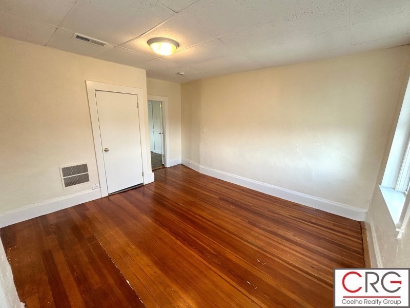 31 Elmwood Street, Unit 6 Revere, MA 02151 - Photo 3 of 16 a view of empty room with wooden floor