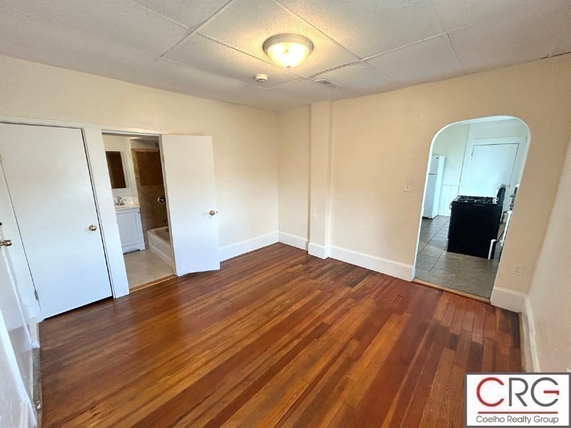 31 Elmwood Street, Unit 6 Revere, MA 02151 - Photo 6 of 16 a view of empty room with wooden floor