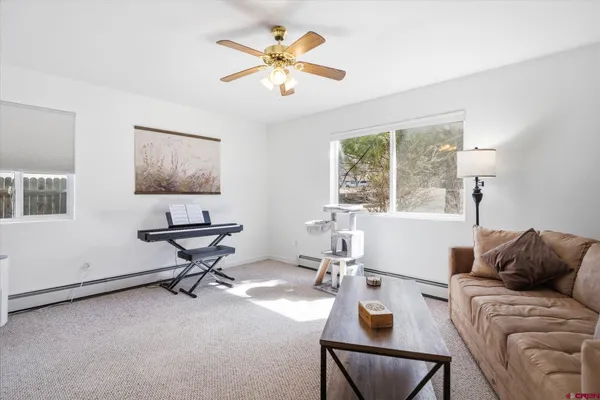 a living room with furniture and a window