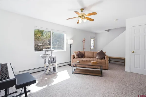 a living room with furniture and a window