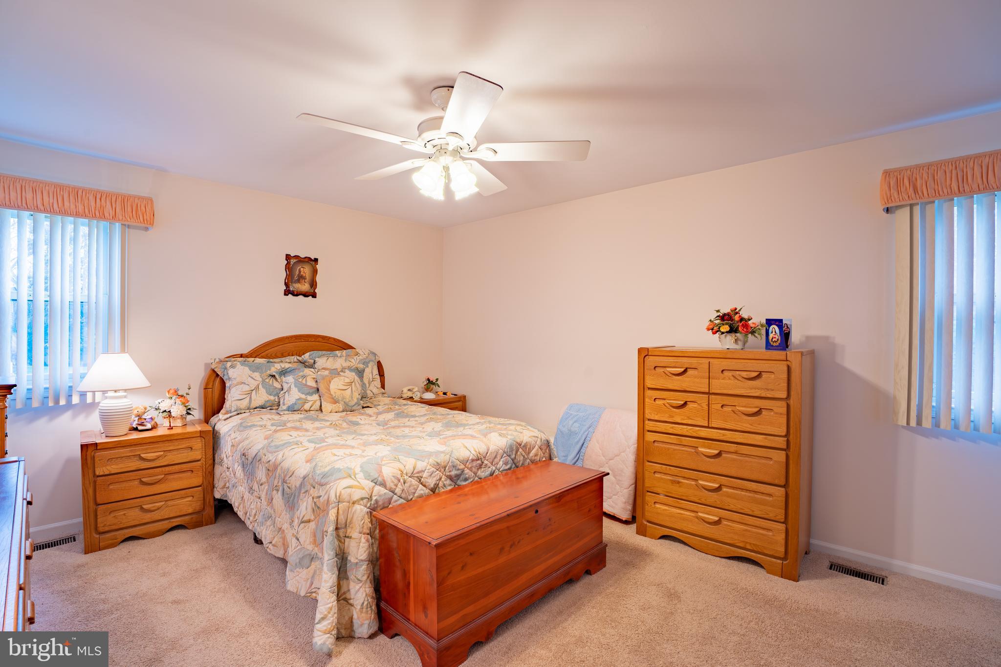 1776 1st Street Langhorne, PA 19047 - Photo 13 of 23 a bedroom with a bed and a chandelier