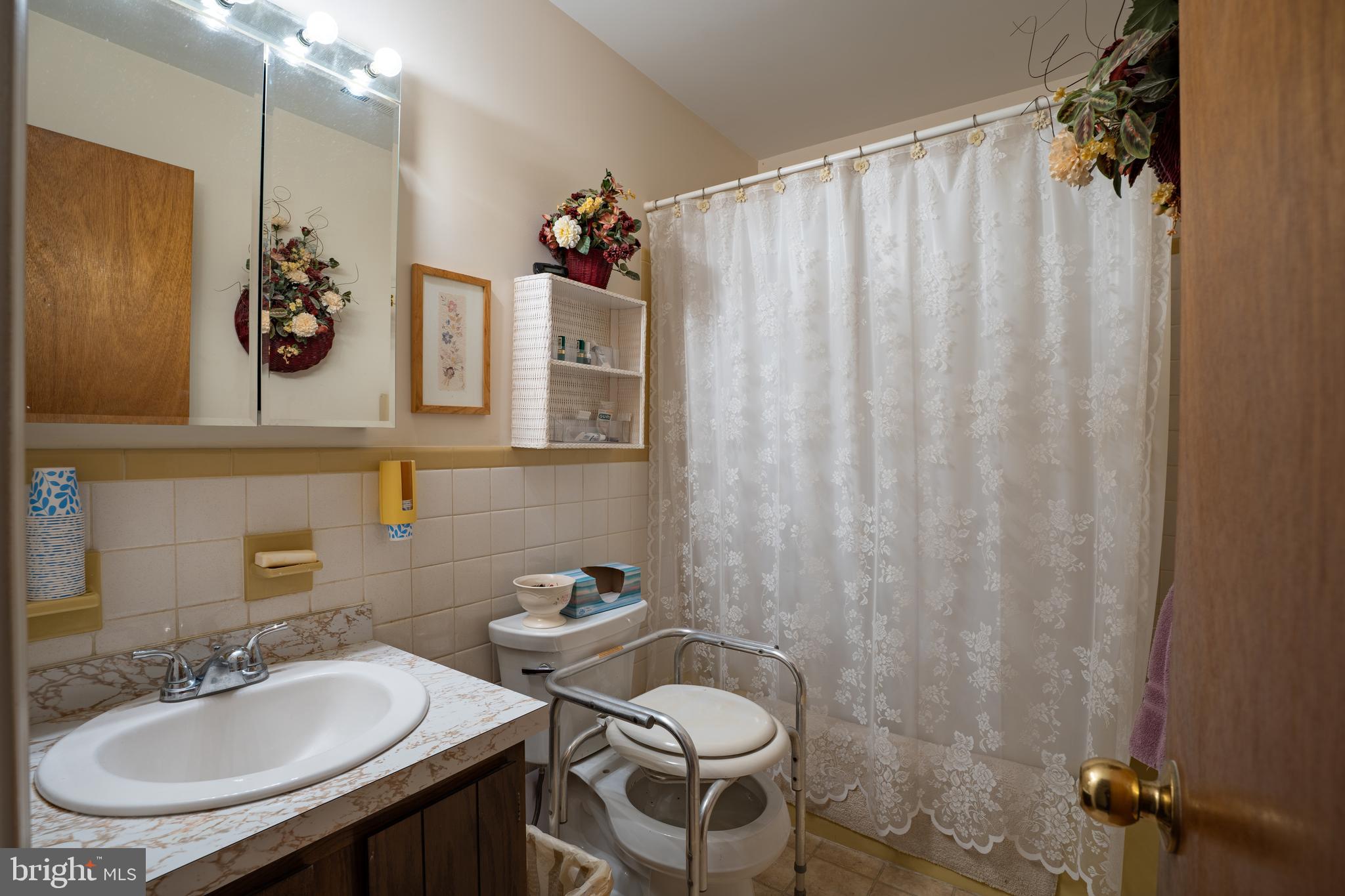 1776 1st Street Langhorne, PA 19047 - Photo 14 of 23 a bathroom with a sink and mirror with toilet