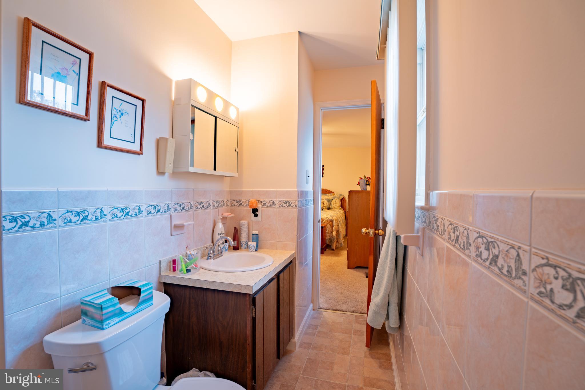 1776 1st Street Langhorne, PA 19047 - Photo 15 of 23 a bathroom with a sink mirror vanity and toilet