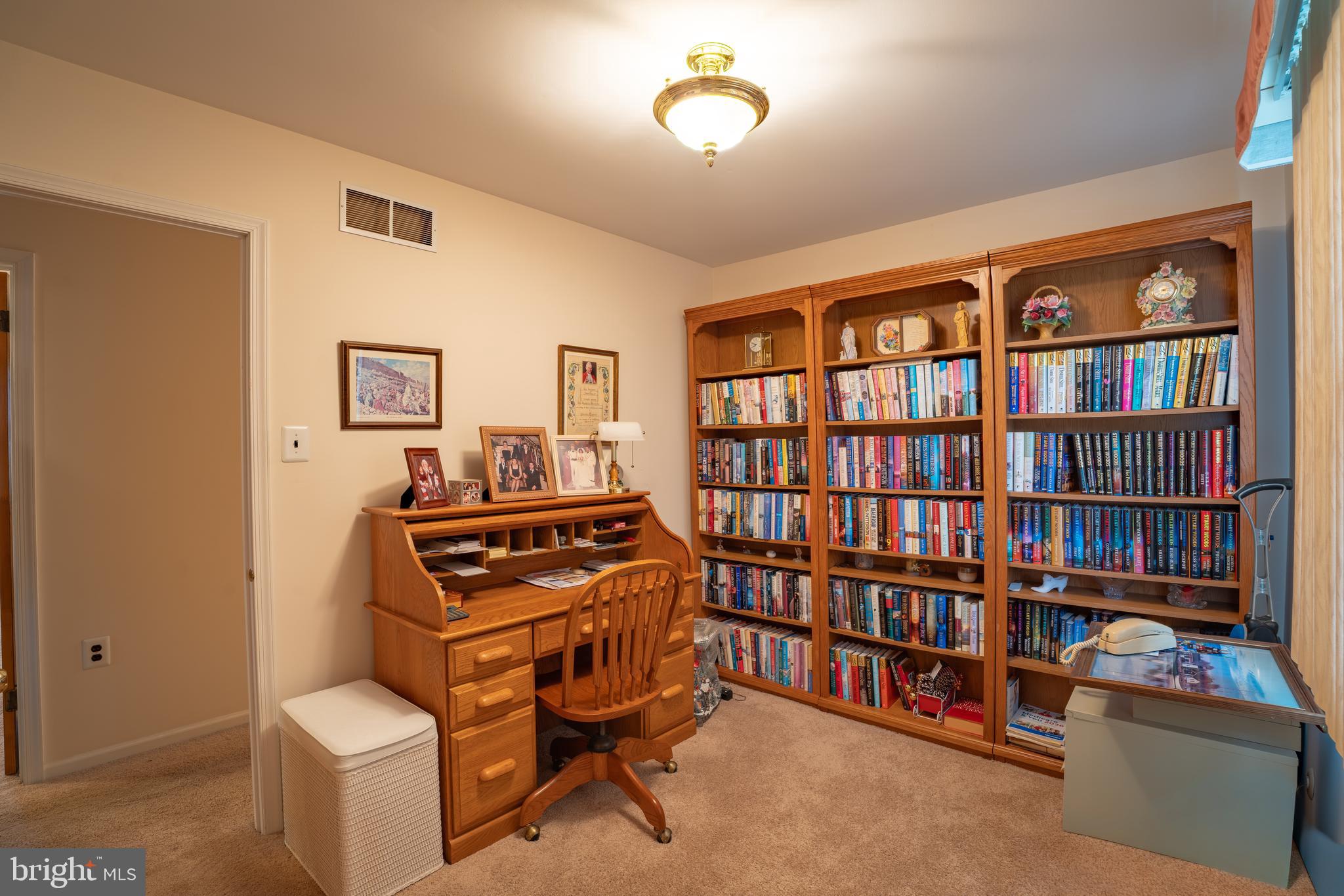 1776 1st Street Langhorne, PA 19047 - Photo 17 of 23 a bedroom with furniture and a book shelf